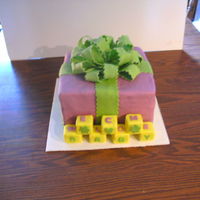 Welcome Baby Purple Green this is a baby shower cake, 3 10inch square, covered in fondant, with RKT blocks that spell out welcome from the top, and baby from the...