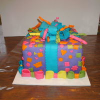 Confetti Princess Cake My daughter picked the colors, theyhad to match her outfit. I covered it, and did the bows, she cut out and put on all the fondant...