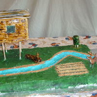 Hunting Cake This is a very nlarge cake all buttercream, except the stream has piping gel on top. The deer stand is cake with fondant sides and a...