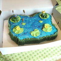 Princess And The Frog This is buttercream cake with piping gel as water, ALL edible. The cattails are fondant/gumpaste mix on spagetti, the frogs, lillies and...