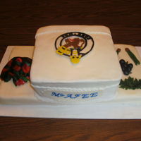 Mcafee Tartan Reunion I made this for a Scottish reunion I included the tartan, the badges (oak leaf, crowberry, and pine needles), and the sheild. The cake is...
