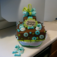 Blue Dots And Bows For A Boy Yellow cake with cream cheese frosting and filled with real strawberries. Covered in Chocolate Fondant with bow accents and baby shoes from...