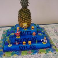 Spongebob Cake this is the cake i made for my sons 1st bday party it was huge 3 layers with a real pineapple on top!