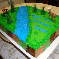 Deer Hunter Cake !/2 sheet cake. BC icing with figurines