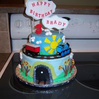 Thomas Train Cake 10 and 6" round with fondant accessories. The train was my son's he had gotten for a previous present.