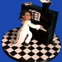 Honkytonksmall.jpg This is real favourite of mine, it is made entirely of pastillage and was done for an examination piece.