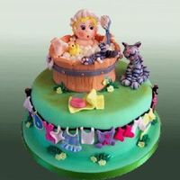 Bathtime With Baby This very cute cake is a little on the old fashioned side, with the wooden bath, and the clothes line, but the cat has fallen into the bath...