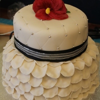 Dress Top tier: quilted pattern, carrot cake with cream cheese filling.Bottom tier: red velvet cake with cream cheese, individual petalsFondant...