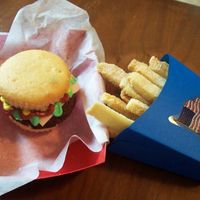 Cupcake Brownie Burger And Fries White cupcake with a brownie for the burger . Buttercream fondant for cheese and red, green and yellow icing for the condements. French...