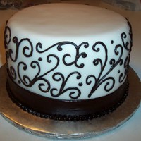 Scroll Work Bridal Shower 3 layer dark chocolate sour cream cake with vanilla cream cheese butter cream and vanilla fondant. I had lots of issues with this cake. It...