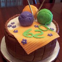 Kniting Basket Cake Orange cake with dark chocolate ganache filling and cream cheese butter cream icing covered in vanilla fonderific fondant (tinted brown)....