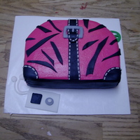 Zebra Print Purse a purse cake for my baby....fondant accents w/bc icing.
