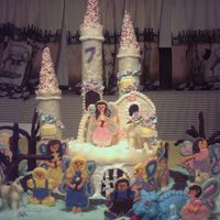 Castle And Kids The castle is cake, kids are cookies, moat is melted sugar.