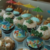 Beach Cupcakes 1 dozen chocolate and 1 dozen vanilla cupcakes iced with buttercream and decorated in assorted beach themes. Toppings include custom...