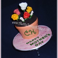 Happy Mother's Day Fondant covered cake and board. Gumpaste Flowers. Ground Oreo for "dirt."