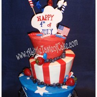 4Th Of July Cakes covered in Buttercream. Fondant decorations. Blueberries and Strawberries. Hand painted "Happy 4th of July" plaque.
