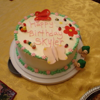 Spring Cake I made this yellow cake filled with pineapple and whipping icing for my daughter's birthday. I made the cute little worms, turtles,...