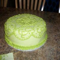 Perry Lace Shower Cake This was a 10" round Italian Creme cake with cream cheese frosting. The piping was done in CC BC to match the napkins and plates.