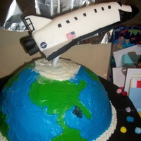 Space, Above And Beyond 40! Space shuttle is made of RCT covered with royal icing then BC then fondant with details piped in royal. The globe is a neopolitian cake,...