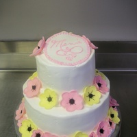 Mamie's Cake This round french vanilla cake was iced with buttercream with merigune. The "poppy" flowers are made out of fondant with black...