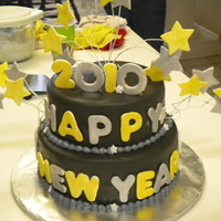New Years Cake! - 2010 Used michele foster fondant (added chocolate and a lot of black food coloring!). used wilton fondant for the stars and let dry for 2 days....