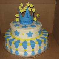 1St Birthday 14" and 10" rounds iced with butter cream and fondant decorations. Crown and stars are gumpaste.