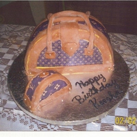 Louis Vuitton Purse This was my first attempt at a purse cake. It was not as hard as I thought it would be. There are some flaws, but it was a learning...