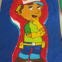Handy Manny i made this cake for my sons 3rdbirthday party.....Handy Manny was hand drawn and made out of royal icing.the cake was also hand carved it...