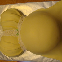 Pretty Mama Iced in BC coverd in MMF. Lace was done with Fondant and RI.