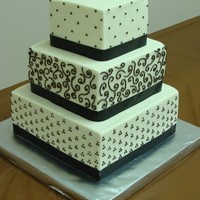 Natural Elegance Cream cheese pound cake with real butter BC icing and piped chocolate designs.