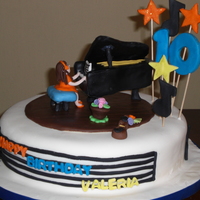 Musical Birthday A cake for a girl who plays the piano and the violin. All details made in fondant. All edible, except for the piano, the girl wanted it as...