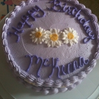 Purple & Daisy B-Day Cake made for a little girl. Daisys are fondant, rest of the cake is b/c