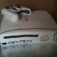 X Box Cake for a 16 yr old boy b-day party. Controller is RKT's covered in fondant. The buttons are skittles & mm's. Cake is vanilla...