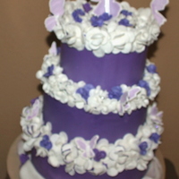 Purple Fantasy wedding cake, purple and white flowers and butterflies