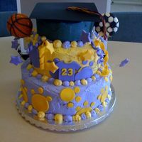 Highschool Graduation This is the first graduation cake I have made. The highschool's mascot is a lion with purple and gold as the colors.