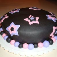 Stars Black fondant with pink and purple stars.