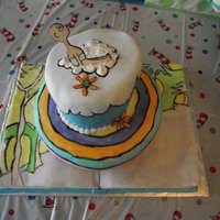 Oh Baby The Places You'll Go All handpainted fondant , gumpaste baby. Book on bottom, topsy turvy for other two tiers. Lots of fun to make!
