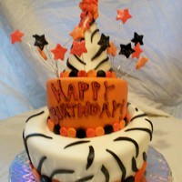 First Topsy-Turvy Fashioned after a pinkcakebox cake (love them!). Birthday hat top is made from gumpaste and is not cake.