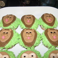 King Of The Jungle Baby Shower Cupcakes Lion and monkey head cupcakes made with MMF.