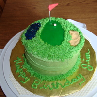 Almost A Hole In One! Vanilla pound cake covered in buttercream. Fondant "green" and golf ball.