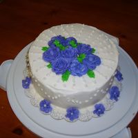 Final_Class_Cake.jpg White cake with buttercream icing and BC roses.