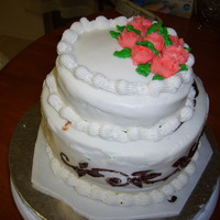 First Time Attempting A Tier Cake two 8" and one 6" cake with chocolate ganache filling and butter cream icing.