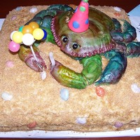 Crab Cake This was a birthday cake I did for my best friends 35th birthday. The crab is yellow cake, buttercream & mmf. bottom cake is choc. cake...