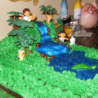 Dora And Diego Birthday Cake jungle theme with green piping and blue glitter jel