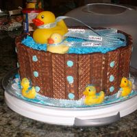 Ducky In Tub Shower Cake nutty buddy sides and whipped frosting water platic ducks and chocolate ducks on bottom
