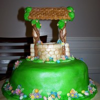 Snow White's Wishing Well Wishing Well is Rice Krispy treat and fondant. Cake is WASC and buttercream. Happy with the wishing well, but rushed putting it together. I...