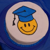 Smiley Face Graduation Cake Made for my daughter's 5th grade graduation party. School colors are yellow and blue.