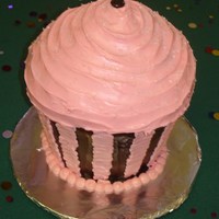 Cupcake Cake For my daughter's 10th b-day. All buttercream w/ M&M on top and sparkle sprinkels. Made with Wilton large cupcake pan.