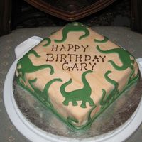 Dinosaur Birthday This is one of my first fondant cakes and I'll be darned if I can get the corners right since...friend's husband loves dinosaurs...