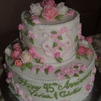 First Stacked Cake First stacked cake for an anniversary, french vanilla cake filled with chocolate ganache, roses are fondant with lustre dust and rosebuds...